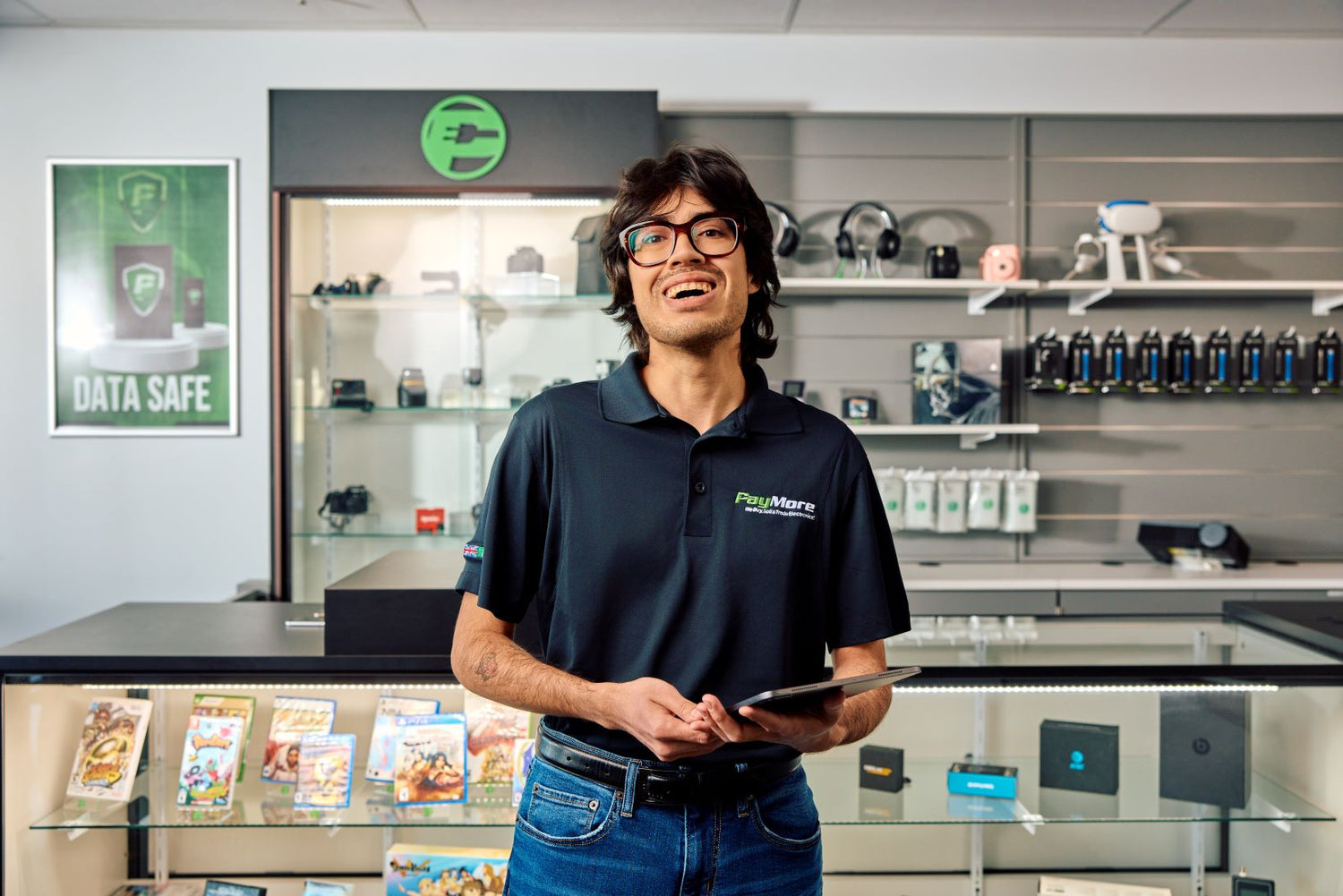 employee smiling and holding a tablet